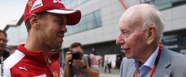 John Surtees talking to Ferrari's Sebastian Vettel in 2015