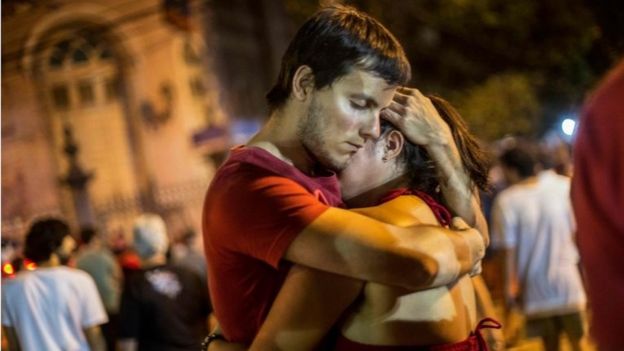 Workers' Party supporters embrace after the result is announced