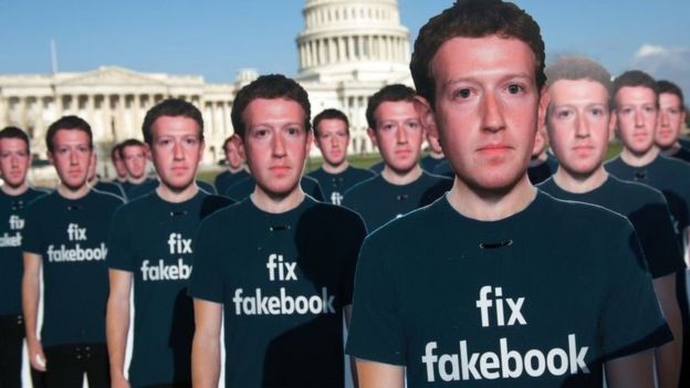 Cardboard cut-outs of Mark Zuckerberg at a demonstration outside the US Capitol building in April 2018