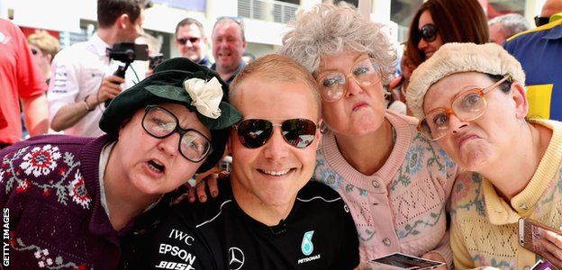 Valtteri Bottas of Mercedes poses with fans