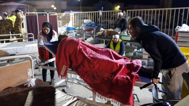 An Iranian injured in the earthquake receives medical care at a temporary hospital in the city of Pole-Zahab in Kermanshah Province, Iran, 13 November 2017