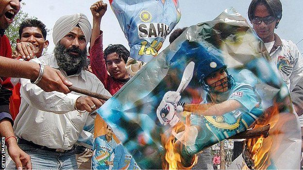 Indian fans burn posters and an effigy of the Indian cricket team following the team's loss against Sri Lanka in the 2007 World Cup