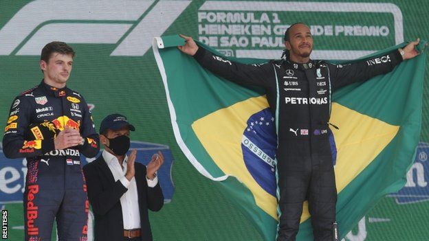 Max Verstappen and Lewis Hamilton on the podium after Hamilton won the Sao Paulo Grand Prix
