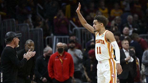 Trae Young waves to the crowd