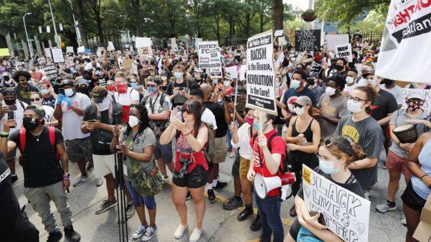 Protesters gathered in central Atlanta on Saturday to protest after Brooks' death