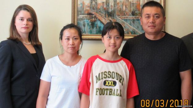JingJing with her family and their lawyer