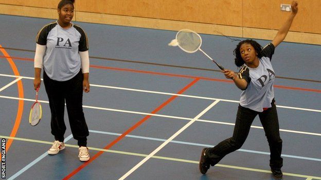 Girls playing badminton