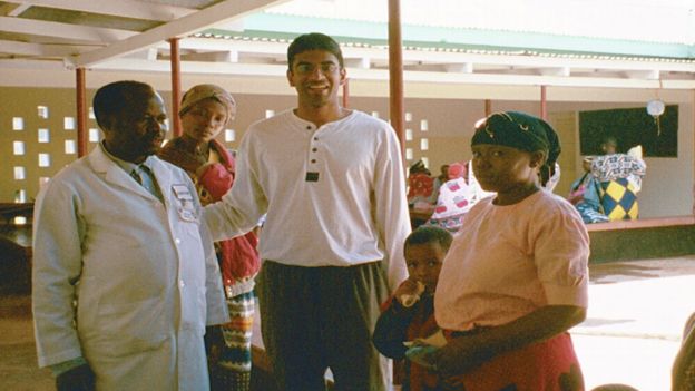 Vasant Narasimhan in Tanzania with medical staff and patients