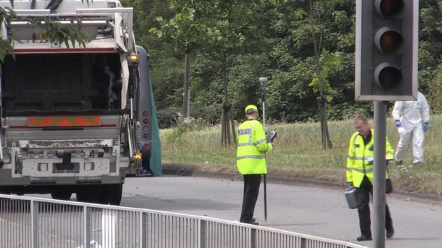 Police officers at the scene of the crash