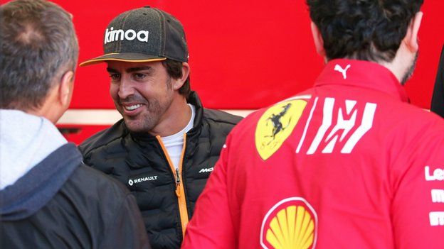 Fernando Alonso with members of the Ferrari team at Barcelona for testing in February