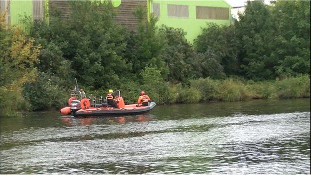 Fire service teams searching the River Taff after reports of a body in the water