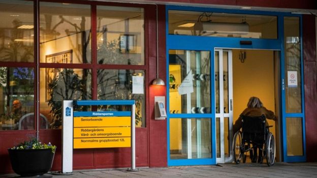 A woman entering her nursing home in Sweden
