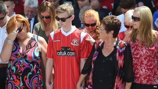 Suzie Evans (l) and Owen Richards joined the crowds at Walsall FC to remember their three family members Adrian Evans, Pat Evans and Joel Richards