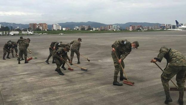 Soldiers clean ashes at Guatemala's international airport