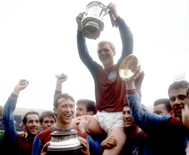 Bobby Moore and his West Ham team-mates with the FA Cup in 1964