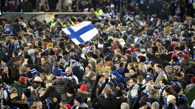 Finland fans invade the pitch
