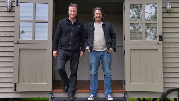 David Cameron in his shepherd's hut with Paul Bennett