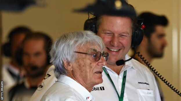 Zak Brown of McLaren talks to F1 boss Bernie Ecclestone