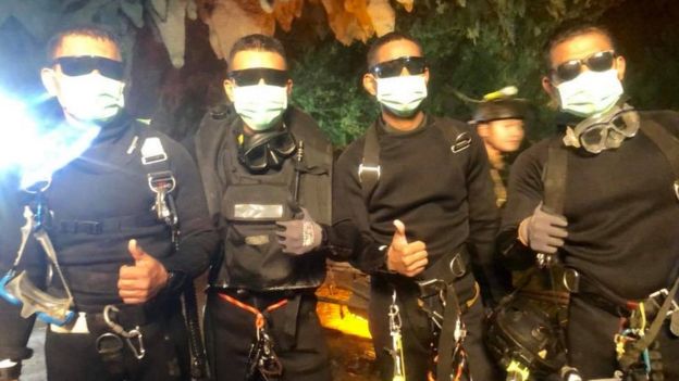 Rescue divers give the thumbs up in the cave July 2018