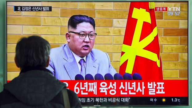 A man watches a broadcast of Kim Jong-un's New Year's speech in Seoul.