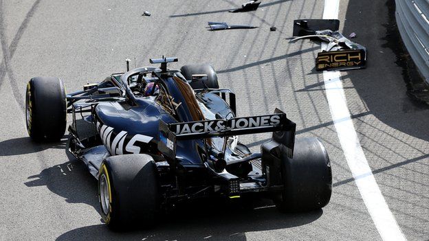 Romain Grosjean crashes in the pit lane