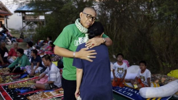 An Indonesian man hugs his daughter after an earthquake