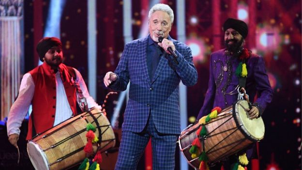 Sir Tom Jones and dhol players