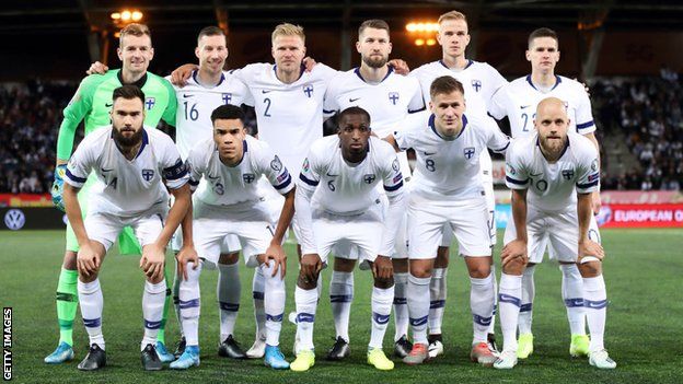 Finland's squad line up for a photo before the game with Lichtenstein in 2019