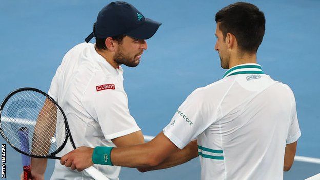 Aslan Karatsev and Novak Djokovic shake hands