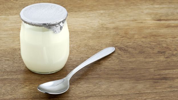 natural yoghurt with a spoon