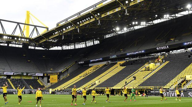 The Dortmund players saluted the empty stands at the final whistle