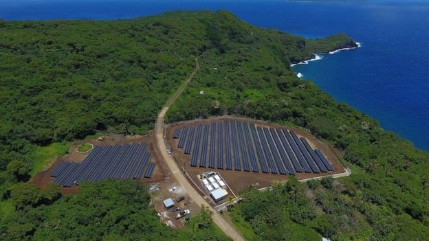 Solar panels on Ta'u, American Samoa, and its nearby power storage battery plant, seen fro the air