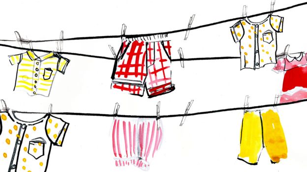 Ilustración de ropa de bebé guindada