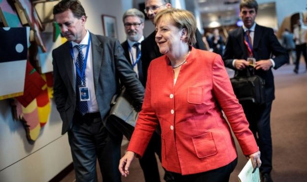 German Chancellor Angela Merkel arrives to give a news conference on the final day of the European Council leaders' summit