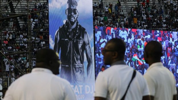 Fans attend a tribute ceremony