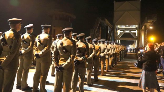 Soldiers from the Rifles march across the Pegasus Bridge