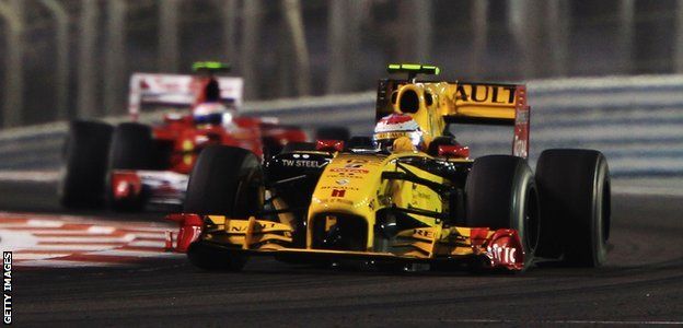 Renault's Vitaly Petrov and Ferrari's Fernando Alonso