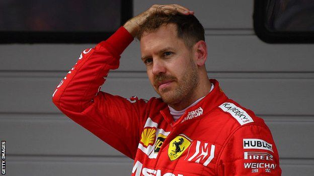 Ferrari driver Sebastian Vettel runs his hand through his hair after the Chinese Grand Prix