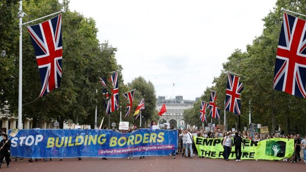 Anti-Brexit protestors walk towards the Buckingham Palace in London, Britain