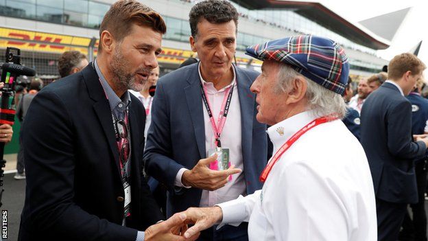 Mauricio Pochettino shakes hands with Sir Jackie Stewart