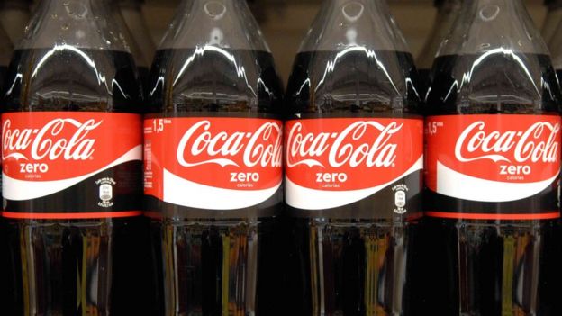 Coca-cola bottles on shelf