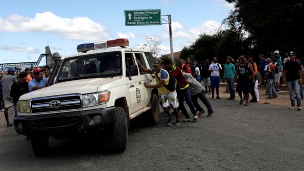An ambulance at the scene where several people were injured during clashes in the southern Venezuelan town of Kumarakapay, 22 February 2019