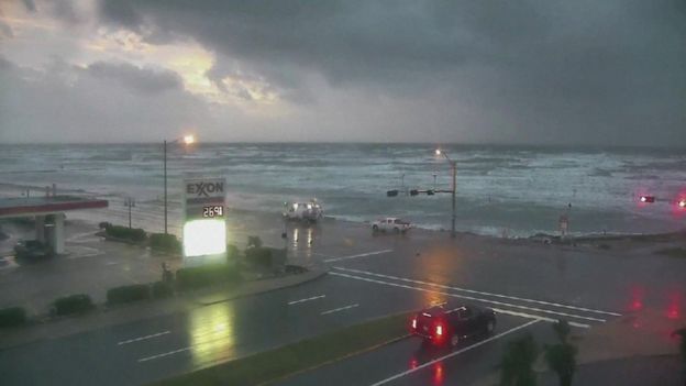 Webcam pic of coast in Galveston, Texas, showing dark clouds and rough seas