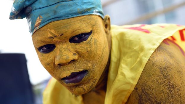 A supporter painted his face and body in yellow, the party's colour of former Prime Minister and presidential candidate Pascal Irenee Koupaki, during a political rally in Cotonou, on March 4, 2016
