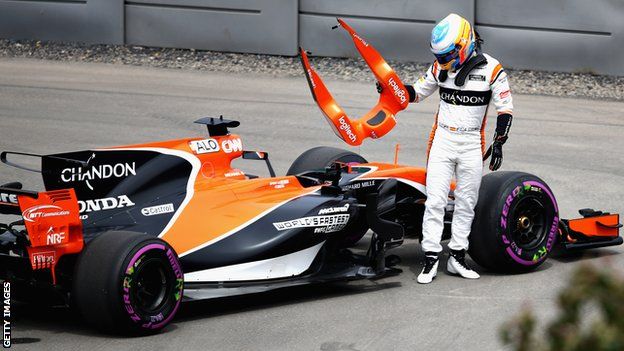 Fernando Alonso gets out of his car during practice at the Canadian Grand Prix