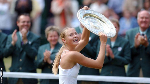 Maria Sharapova holds up the Venus Rosewater Dish on Centre Court after winning Wimbledon in 2004