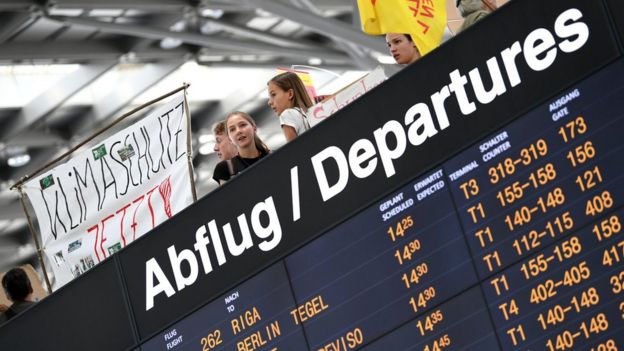 People attend a "Fridays for Future" protest, claiming for urgent measures to combat climate change, at Stuttgart airport, Germany July 26, 2019