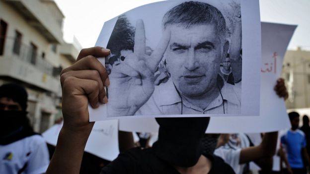 Bahraini Shia Muslim youth holds picture of rights activist Nabeel Rajab during demonstration in village of Daih, west of Manama, on June 11, 2012