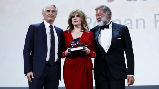 Producer Alain Goldman, actor Emmanuelle Seigner and co-producer Luca Barbareschi accepted the award for An Officer and a Spy at Venice Film Festival, 7 September 2019