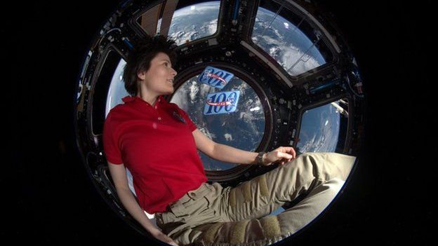 Samantha Cristoforetti sitting in the ISS